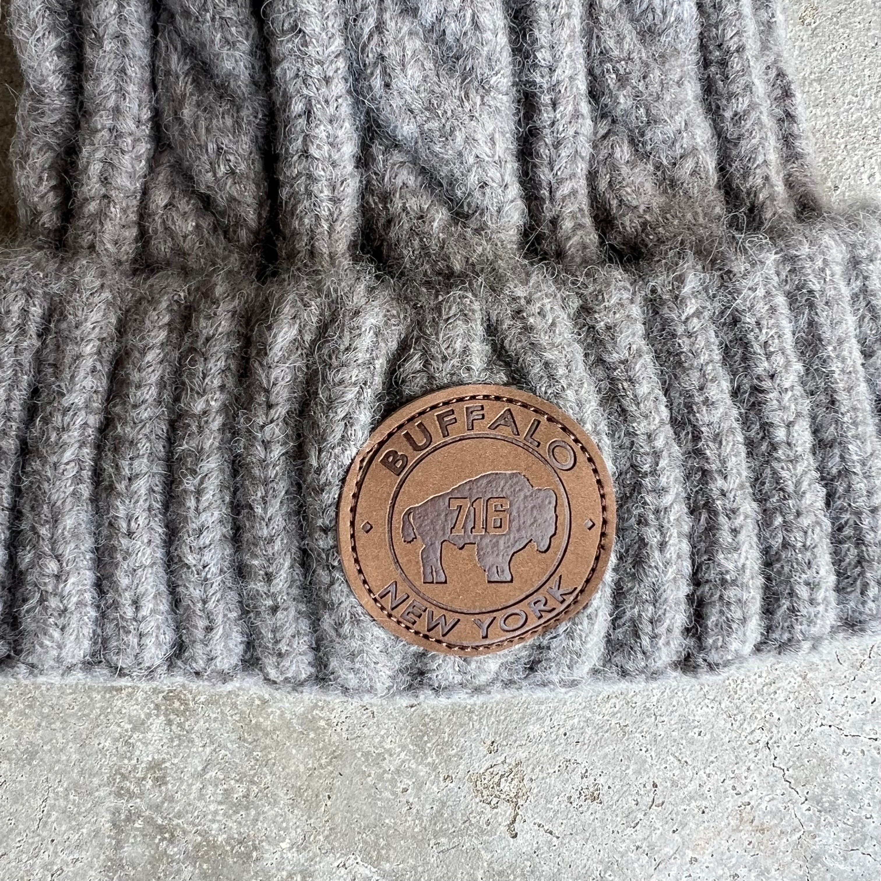 Hat: Buffalo Leather Patch And Pom Pom